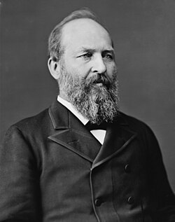 Portrait photograph of Garfield, who has a full beard and receding hairline, wearing a double-breasted suit