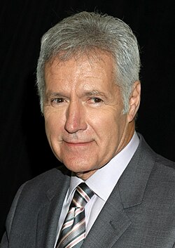 Trebek wearing a dark grey suit