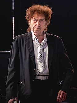 Bob Dylan standing on stage