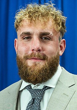 Headshot of Jake Paul, a white, young man with short, blond hair and beard