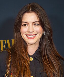 A head shot of Anne Hathaway as she poses for the camera