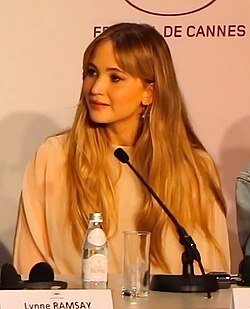 Lawrence glancing to her right and smiling