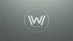 The letter "W" inside a circle as white text on a grey background.