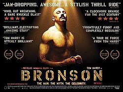 A muscular man, illuminated in sunlight and wearing boxing gloves, glances at the camera. The film's title is shown in golden bold text at the bottom of the image and various critic's reviews are displayed around the image.